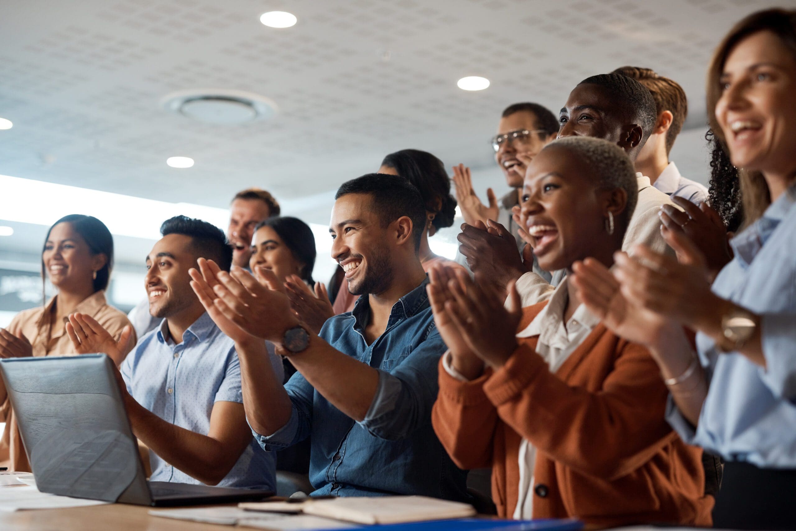 Applause, support and success with a business team clapping as an audience at a conference or seminar. Meeting, wow and motivation with a group of colleagues or employees cheering on an achievement